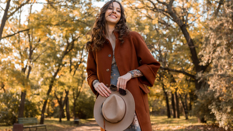 Woman walks outdoors