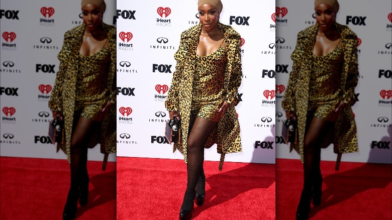 Jackie Aina wearing leopard prints