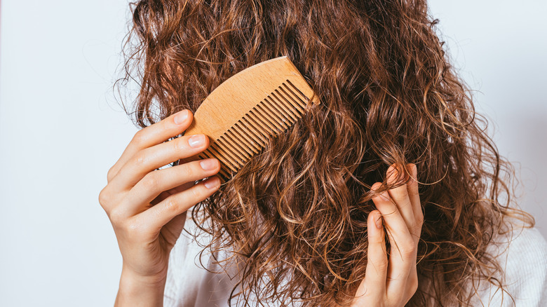 combing voluminous curly hair