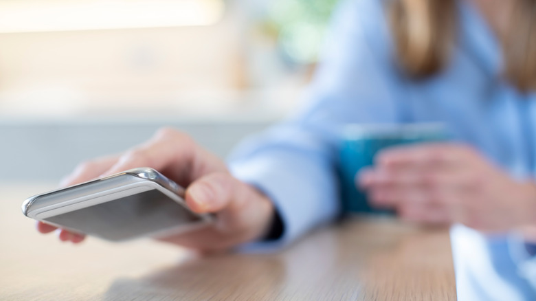 woman putting phone down