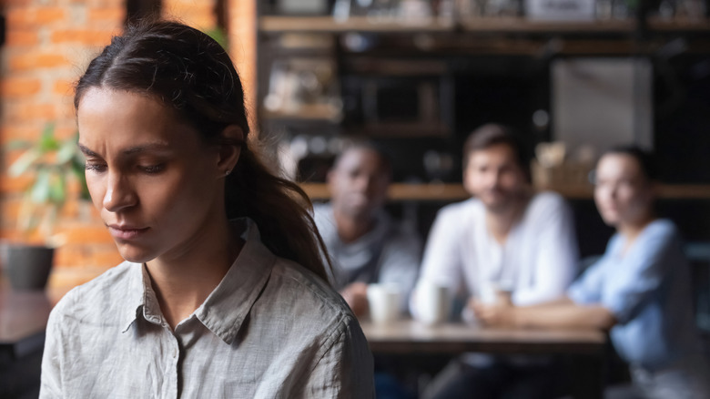 woman sad with friends