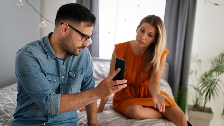 couple arguing about phones
