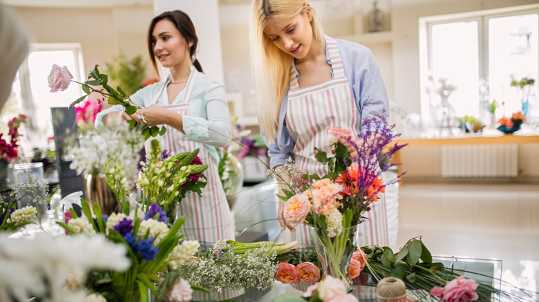 Women arranging flowers