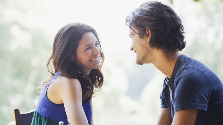 man and woman talking