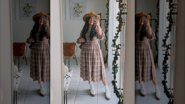 woman wearing plaid dress