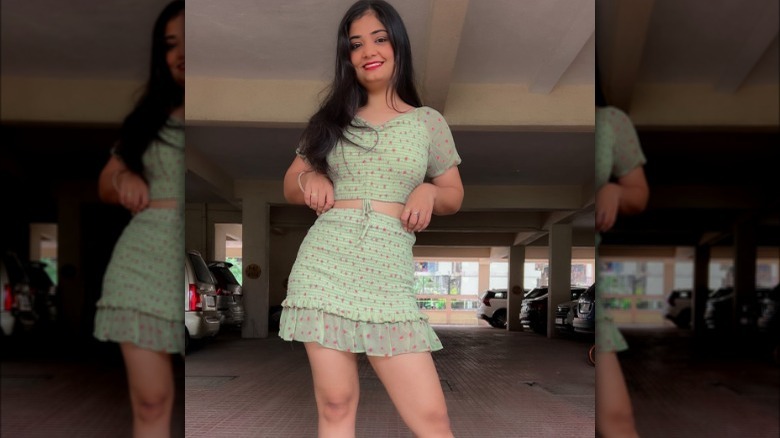 woman wearing green skirt set