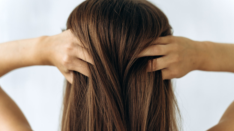 woman running hands through hair