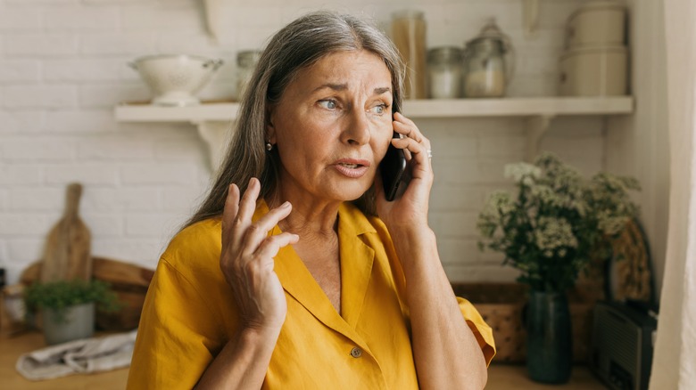 Old woman talking on phone