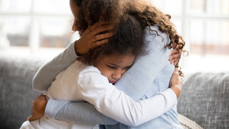 Mother hugging child