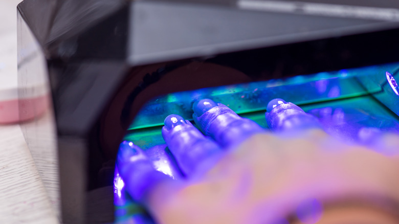 Person using LED lamp