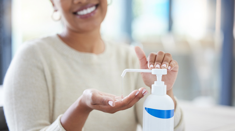 Person using hand sanitizer