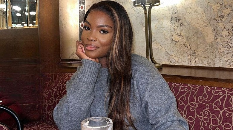 Person with long hair with highlights and layers