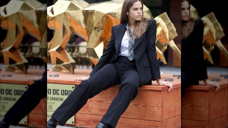 Woman poses in pantsuit 