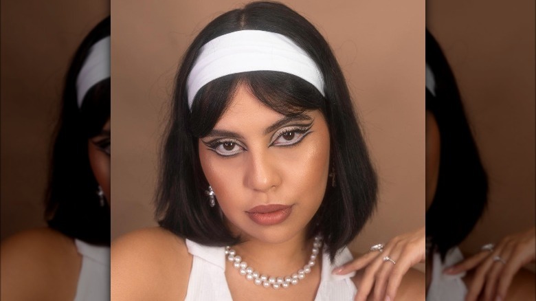 Woman models tri-liner makeup