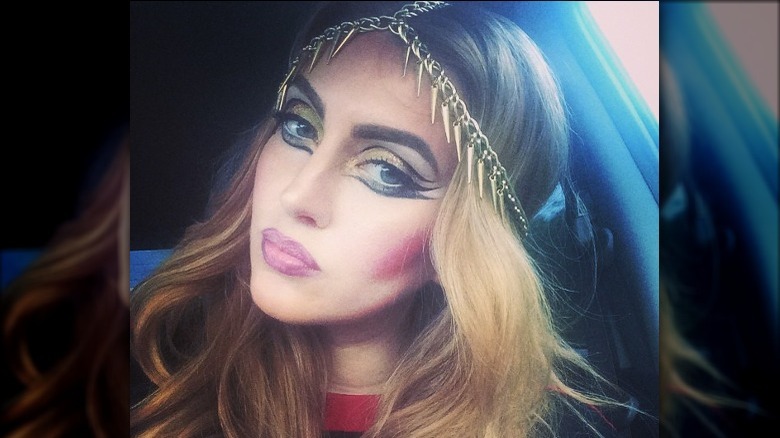 Woman models tri-liner makeup