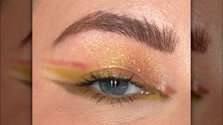 Woman models tri-liner makeup