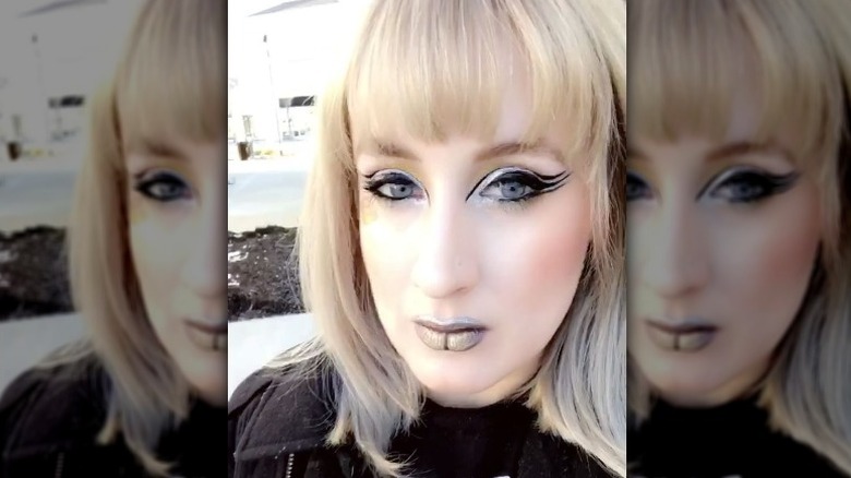 Woman models tri-liner makeup