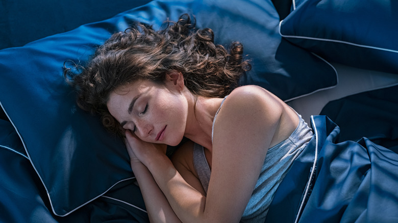 Woman sleeping on silk pillowcase