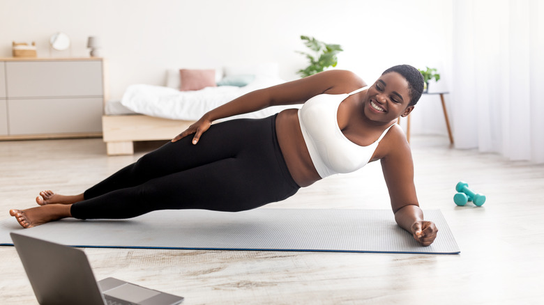 person doing side plank workout