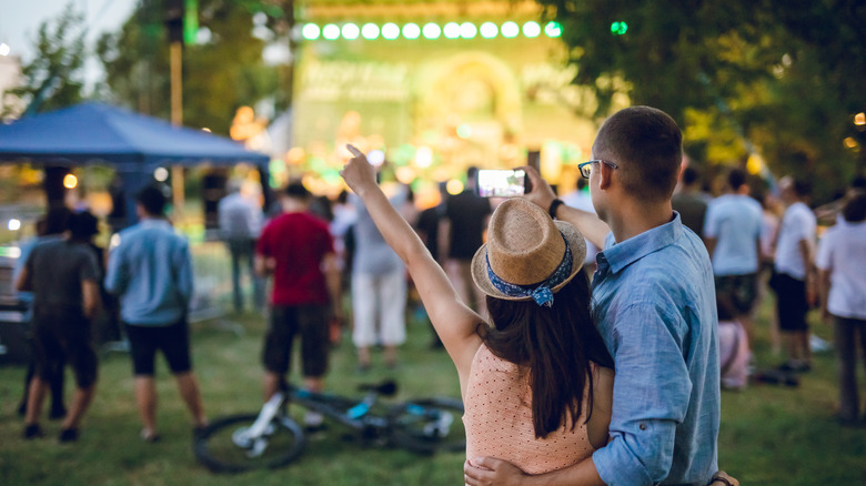 Couple at outdoor music performance