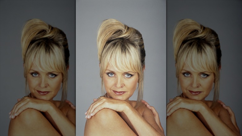 Twiggy poses for a photoshoot with an updo