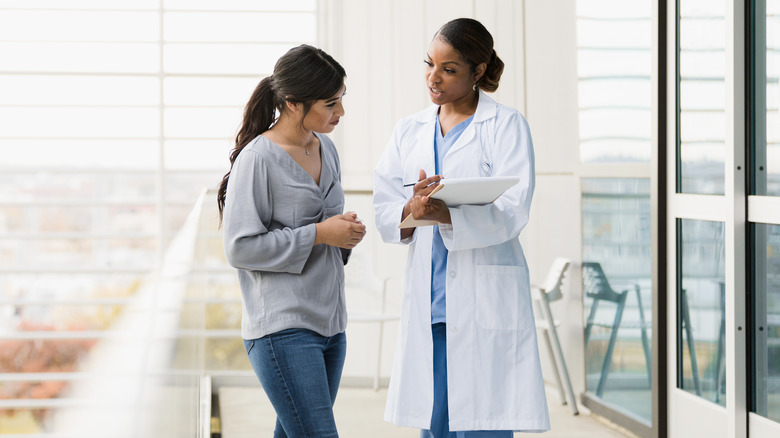 woman talking to doctor
