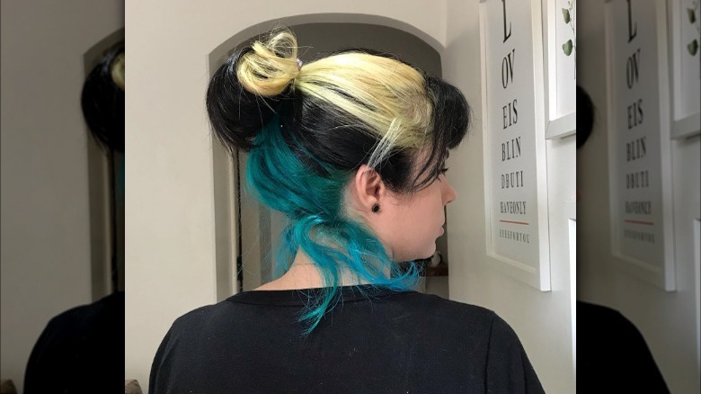 Girl with blond, teal underlayer style