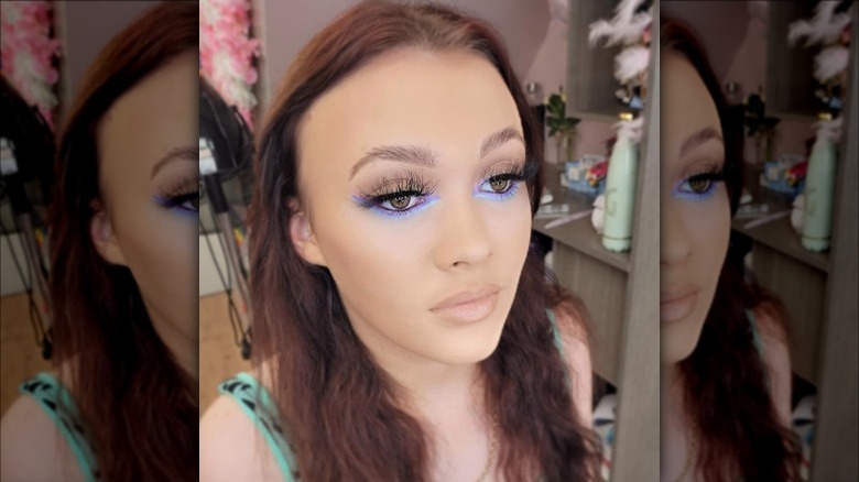 woman with purple and blue underliner