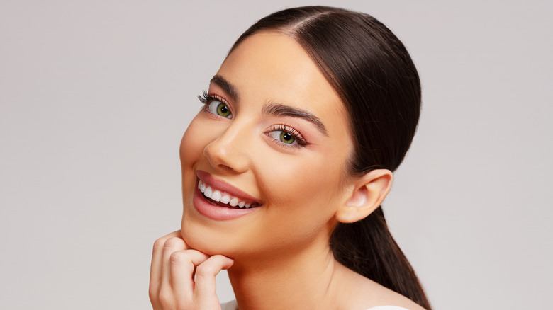 smiling woman with short philtrum