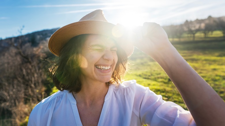 Woman squinting in sun