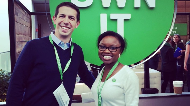 Nate Barbera and Desirée Stolar posing with lanyards