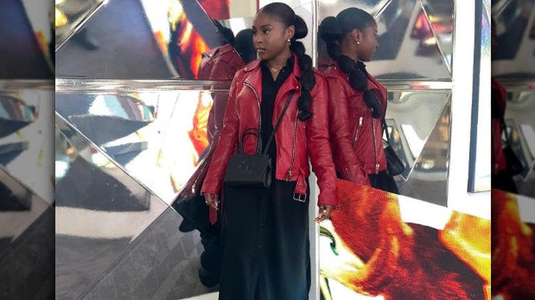 Woman in red leather jacket