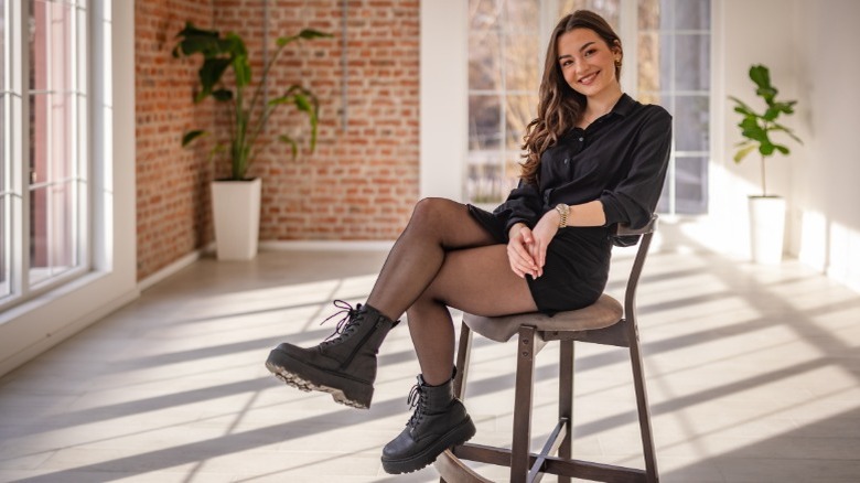 Woman in black shirt dress, black platforms