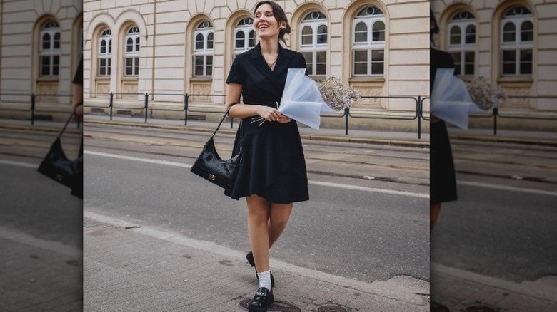Woman in an LBD, loafers