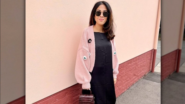 Woman in LBD, pink jacket
