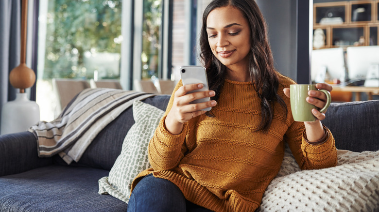 Woman on couch with phone
