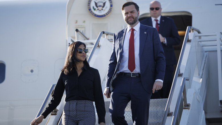 JD Vance and Usha Vance getting off a plane