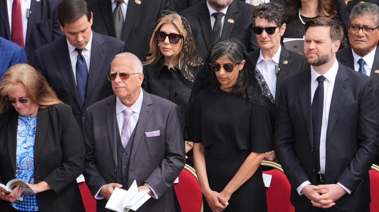 The Vances at mass in Italy wearing black