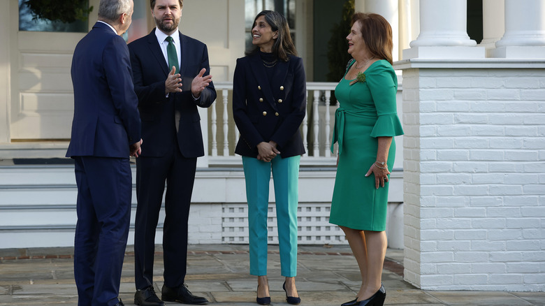 Usha Vance in teal pants next to Irish taoiseach and her husband JD Vance
