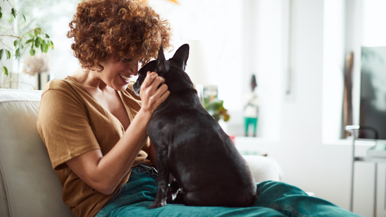 Woman smiling at dog