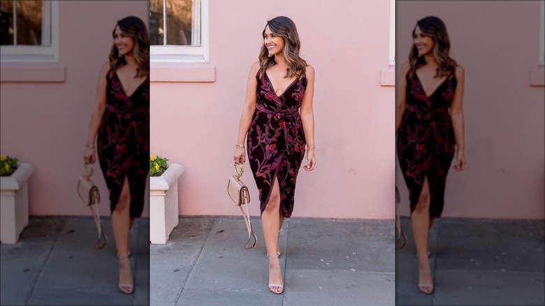 woman wearing embroidered velvet dress