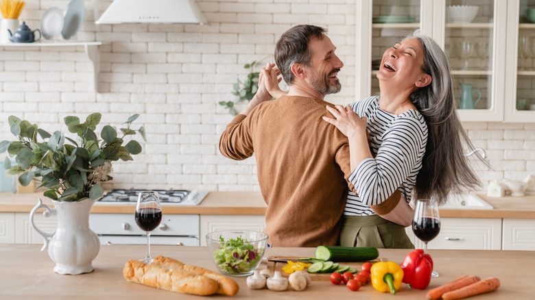Couple dances in kitchen
