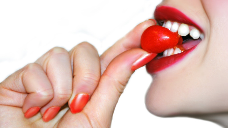 Woman with red nails