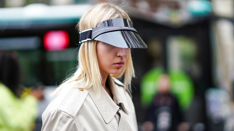 woman with a black transparent visor
