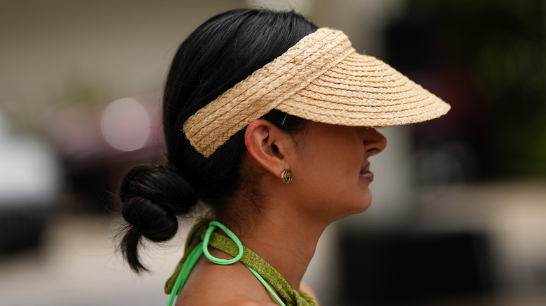 woman with straw visor