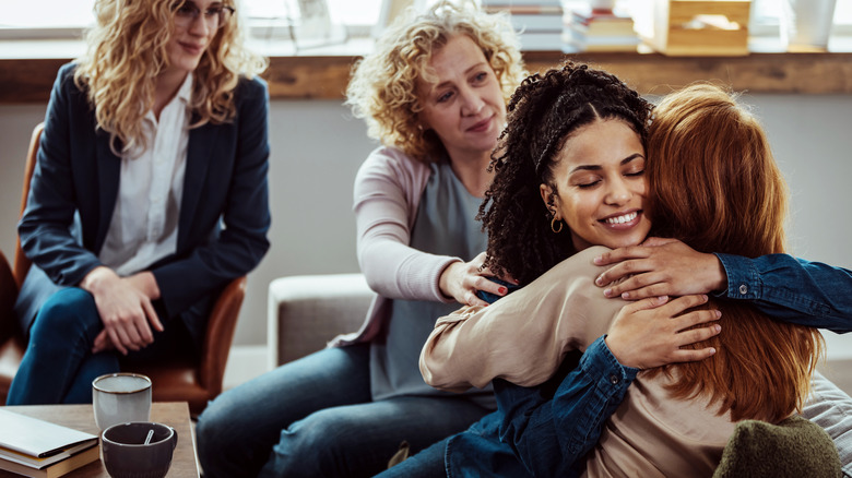 Friends hugging at gathering