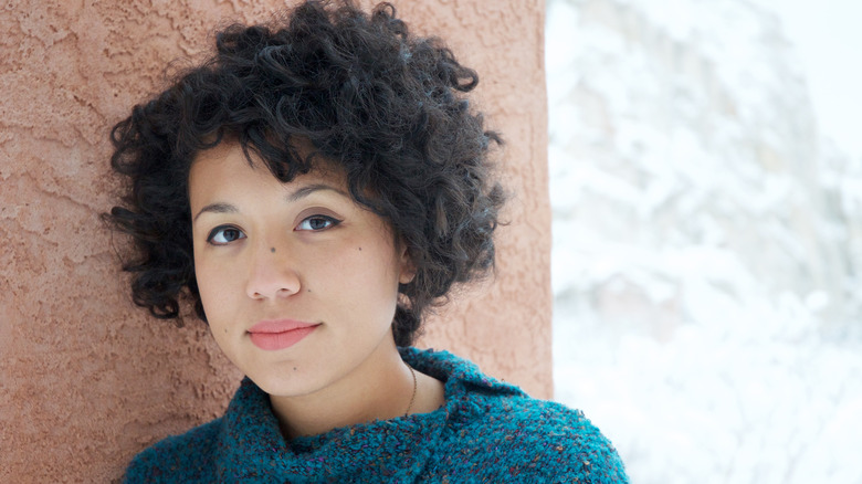 Woman with multiple moles on face