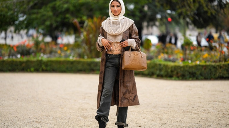 woman wearing washed black denim jeans