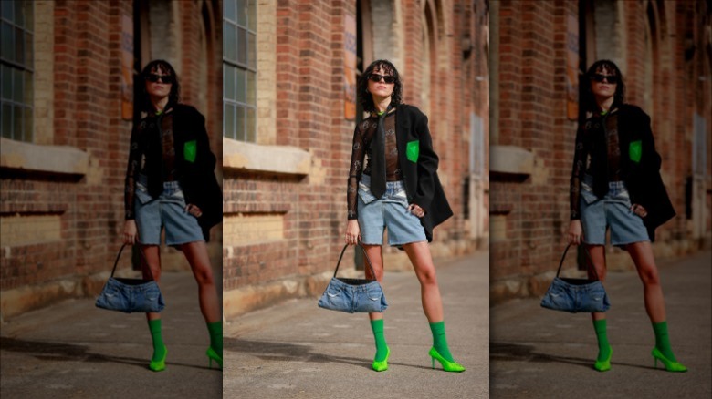woman carrying denim bag
