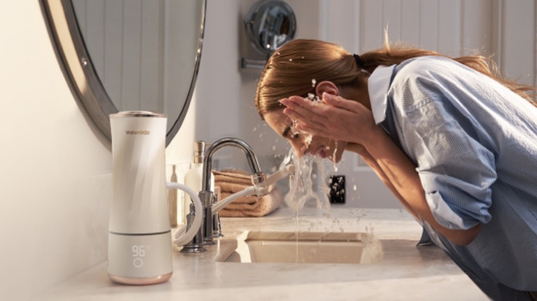 Woman using Waterdrop Skincare Face Washer